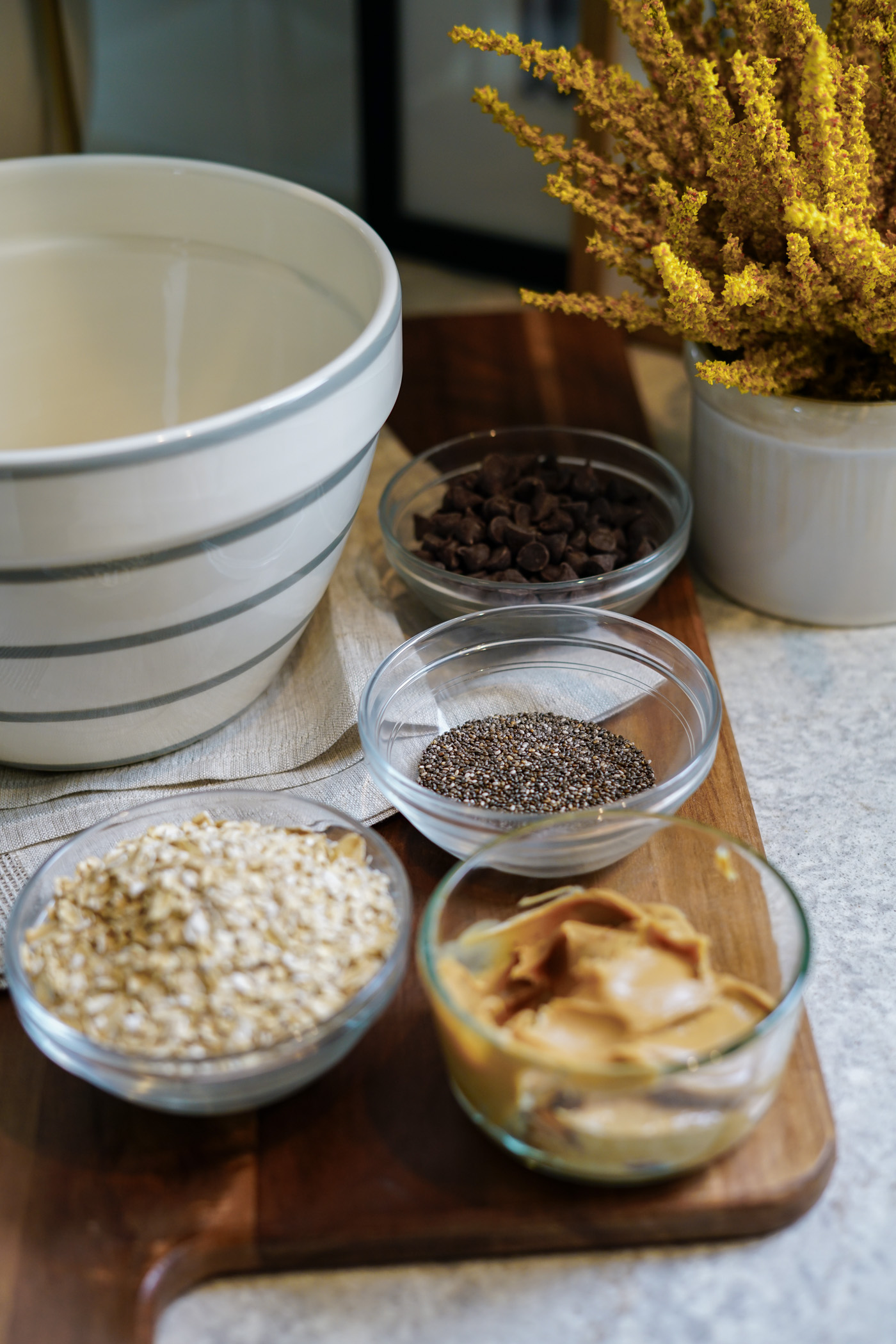 A kitchen counter with ingredients for vegan protein balls. 